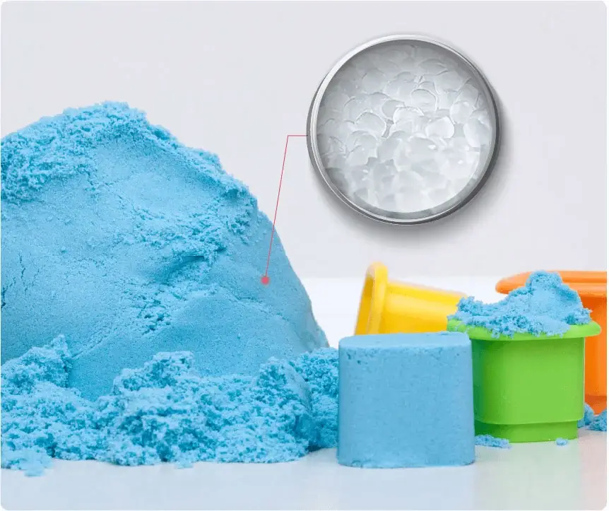blue kinetic sand with molds and texture close-up